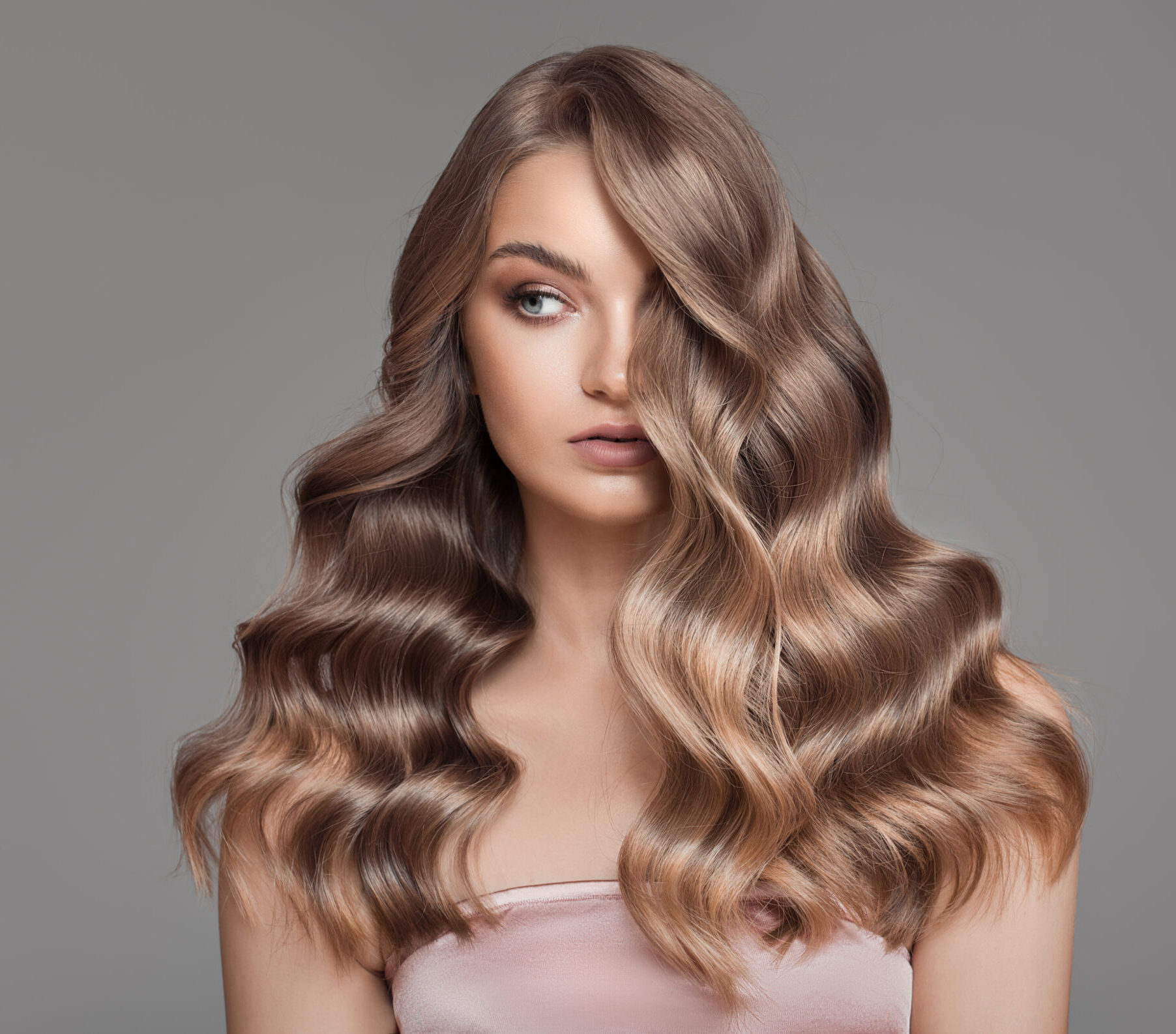 Woman with light brown wavy hair