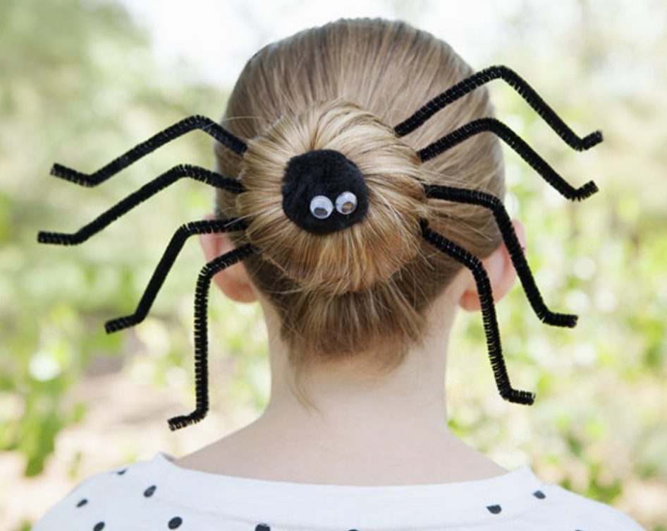 Blonde woman with fake spider halloween hairstyle costume