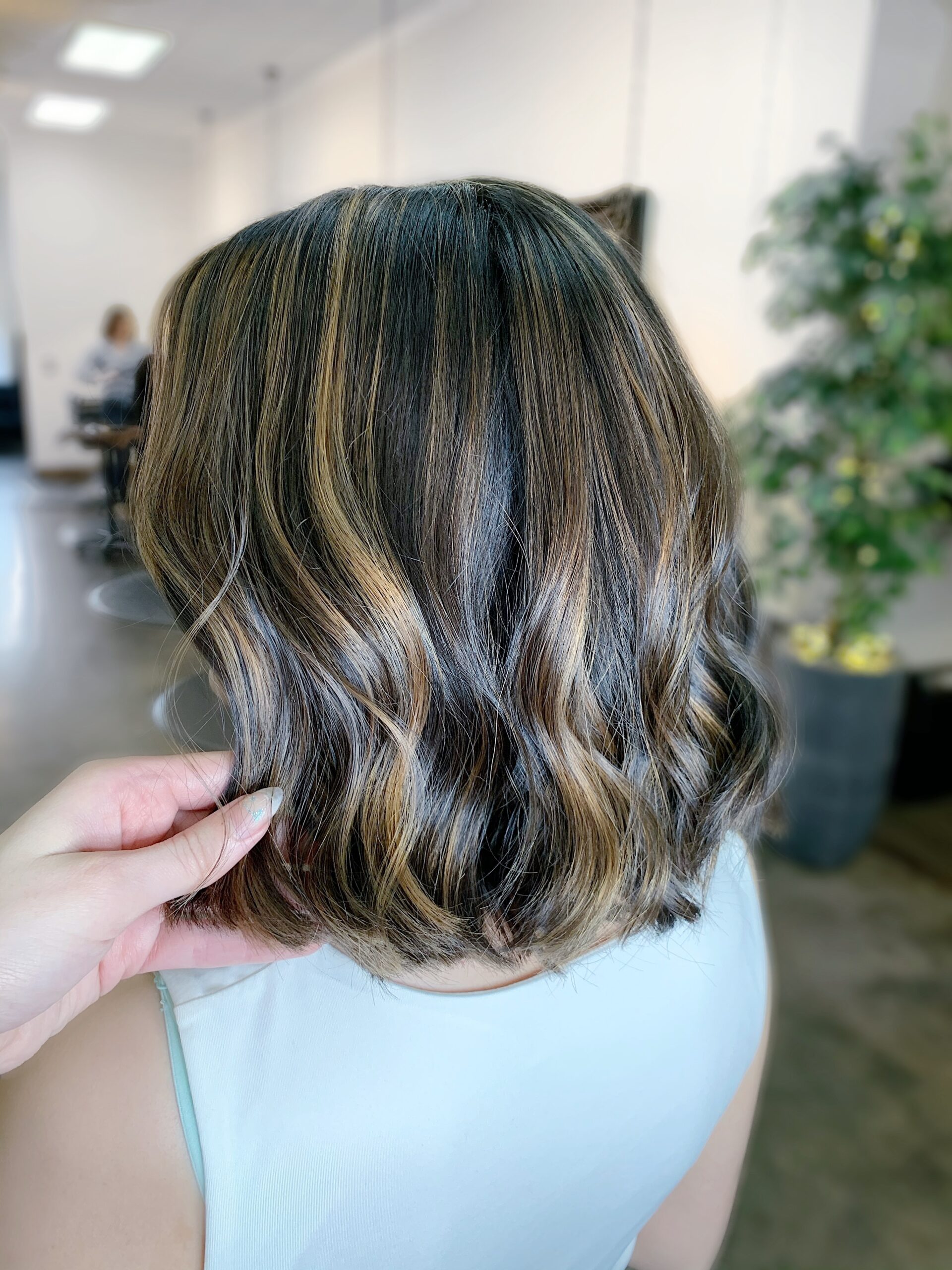 Woman with reverse bayalage hair colour